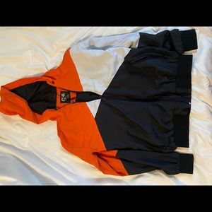 Orange, white & black wind breaker , no rope